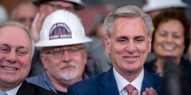 Speaker Kevin McCarthy and House Majority Leader Steve Scalise applaud after Republicans passed a sprawling energy package that would counter virtually all of President Joe Biden's agenda to address climate change, at the Capitol, Thursday, March 30, 2023.