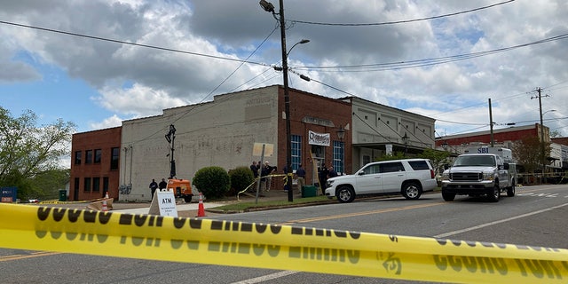 Investigators worked at the site of a fatal shooting in downtown Dadeville, Alabama, on Sunday after four people were killed during a shooting at a sweet 16 birthday party Saturday night, the Alabama Law Enforcement Agency said.