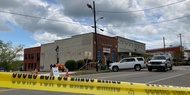 Investigators worked at the site of a fatal shooting in downtown Dadeville, Alabama, on Sunday after four people were killed during a shooting at a sweet 16 birthday party Saturday night, the Alabama Law Enforcement Agency said.