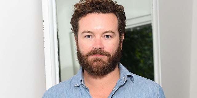 Danny Masterson wears blue shirt at event