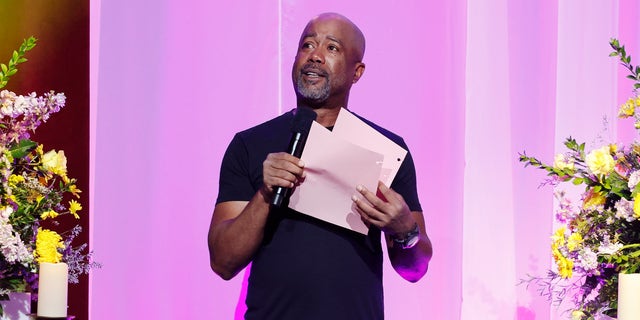 Darius Rucker speaks at a tribute to Loretta Lynn at the Grand Ole Opry in 2022.