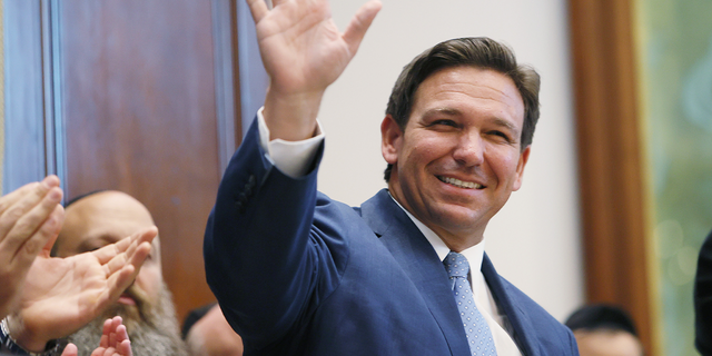 Florida Gov. Ron DeSantis arrives to speak during a press conference at the Shul of Bal Harbour June 14, 2021, in Surfside, Fla.