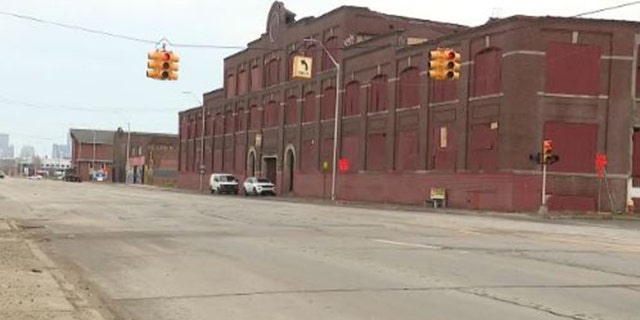 Police have not identified the man who went into this building to reportedly help two dogs when he was mauled to death by them.