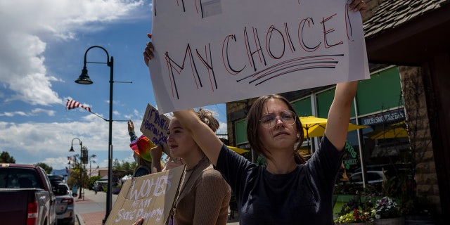 Teenagers protest the Supreme Court's Dobbs v Jackson Women's Health decision on July 2, 2022, in Driggs, Idaho. Shortly after the decision, a near-total ban on abortions took effect in Idaho.