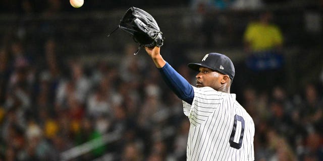 Domingo German, #0 of the New York Yankees, looks to receive the ball back in the second inning against the Pittsburgh Pirates during a Grapefruit League Spring Training game at George M. Steinbrenner Field on March 6, 2023 in Tampa, Florida.