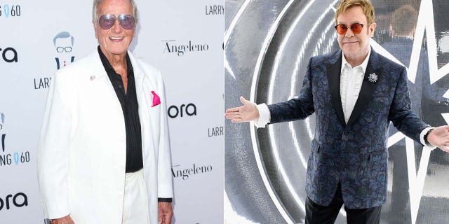 pat boone smiling elton john with hands out