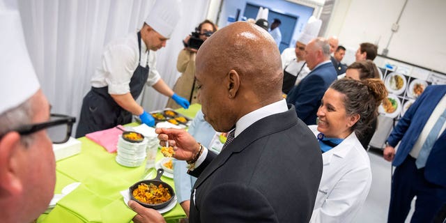New York City Mayor Eric Adams samples a plant-based meal to be served to hospital patients.