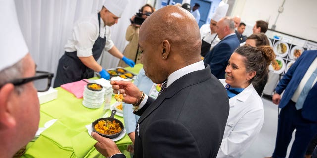New York City Mayor Eric Adams samples a plant-based meal to be served to hospital patients.