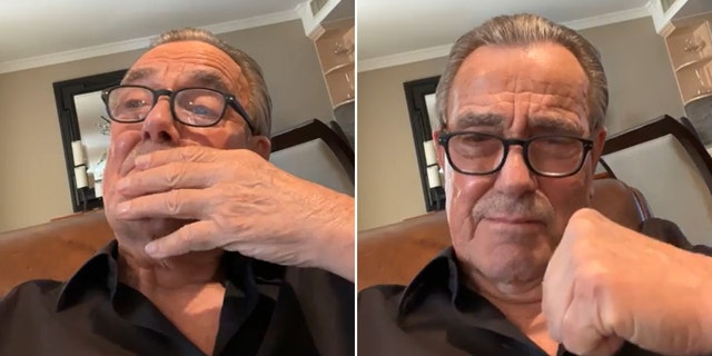 Eric Braeden in a black shirt and black rimmed glasses brings his hand to his face, an emotional split puts his fist in the air
