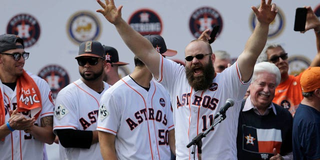 Evan Gattis #11 of the Houston Astros is introduced during the Houston Astros Victory Parade on November 3, 2017 in Houston, Texas. The Astros defeated the Los Angeles Dodgers 5-1 in Game 7 to win the 2017 World Series.