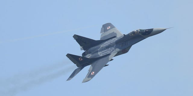 A Mikoyan MiG-29 plane of the Polish Air Force flies on June 1, 2016, in Schoenefeld, Germany. Poland plans to give five old MiG-29 planes to Ukraine to combat Russian invasion.