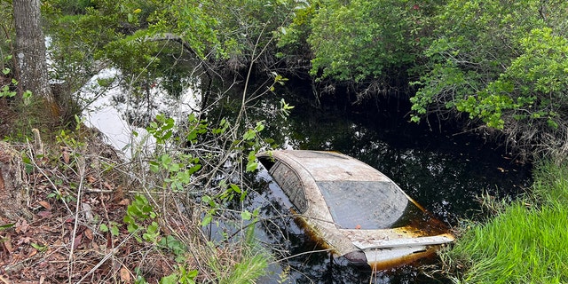 Volunteer teams located the partially submerged vehicle in a canal along Pioneer Trail near New Smyrna Beach after the water level dropped significantly, officials said.