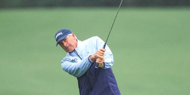 Fred Couples of The United States plays his third shot on the 18th hole during the completion of the weather-delayed second round of the 2023 Masters Tournament at Augusta National Golf Club on April 8, 2023, in Augusta, Georgia. 