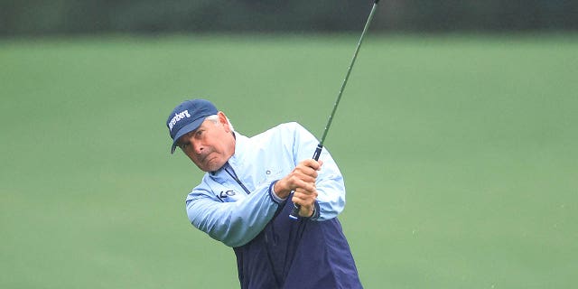 Fred Couples of The United States plays his third shot on the 18th hole during the completion of the weather-delayed second round of the 2023 Masters Tournament at Augusta National Golf Club on April 8, 2023, in Augusta, Georgia. 