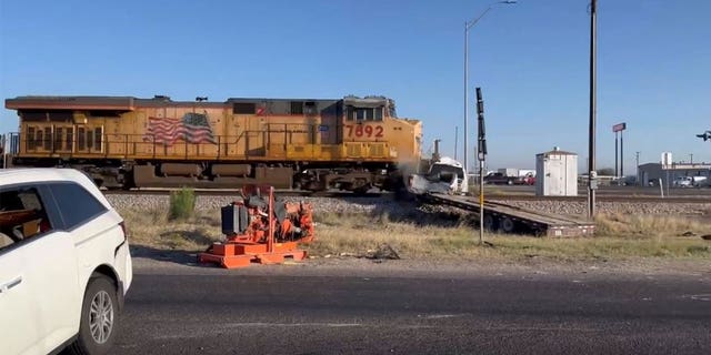 Freight Train smashes into truck