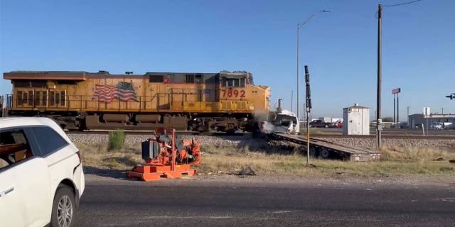 Freight Train smashes into truck