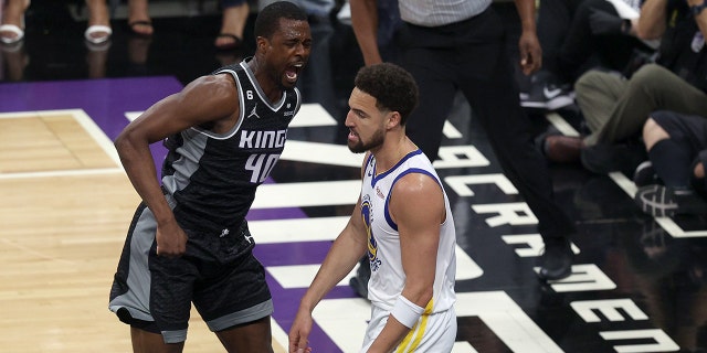 Harrison Barnes #40 of the Sacramento Kings reacts after he dunked the ball on Klay Thompson #11 of the Golden State Warriors in the first half during Game Two of the Western Conference First Round Playoffs at Golden 1 Center on April 17, 2023 in Sacramento, California.