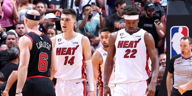 Tyler Herro (14) and Jimmy Butler (22) of the Miami Heat during a game against the Chicago Bulls during the 2023 play-in tournament April 14, 2023, at Kaseya Center in Miami, Fla.