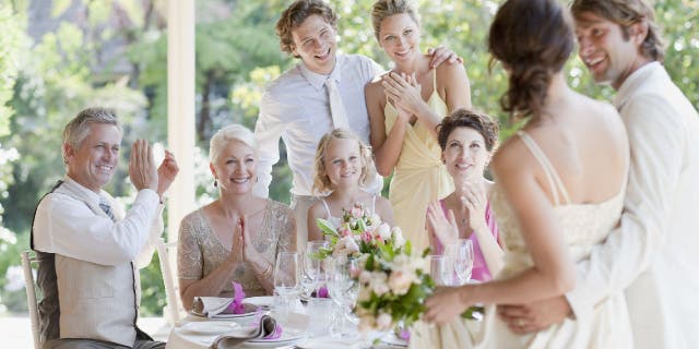 Family celebrating at wedding reception