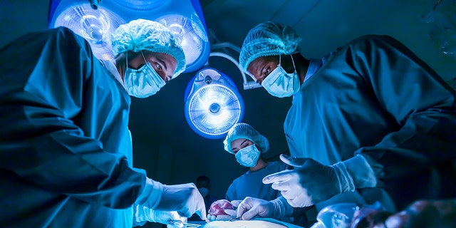 surgery team over patient