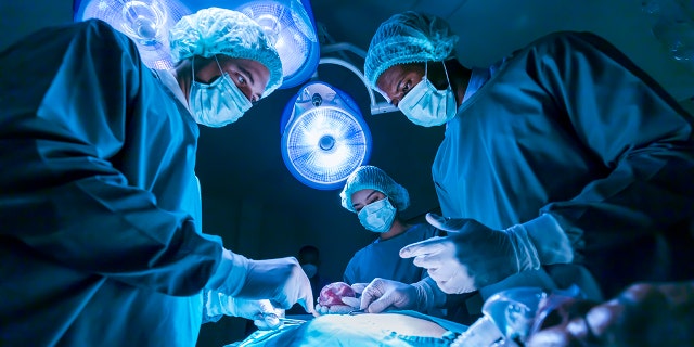 surgery team over patient