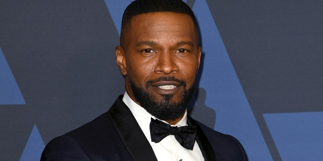 Jamie Foxx wears suit and tie on red carpet at movie premiere