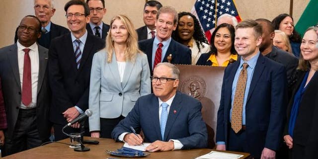 Jay Inslee signing legislation