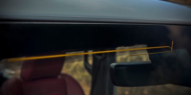 New 2024 Jeep Wrangler has an antenna integrated into the windshield.