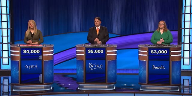 "Jeopardy!" contestants, including Brian Henegar, on Tuesday's show.