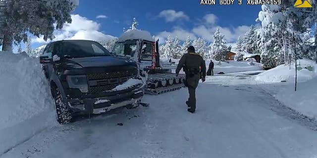 Officers walk through scene of Jeremy Renner's snowplow accident on New Year's Day in Lake Tahoe.