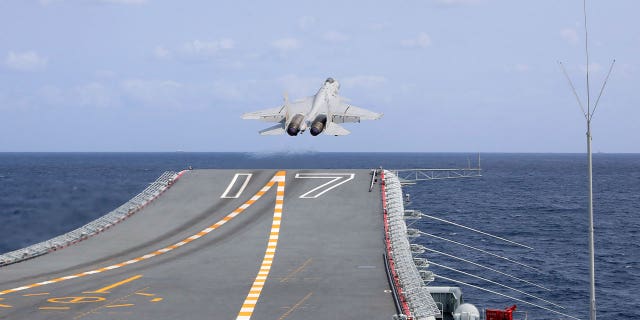 A J-15 Chinese fighter jet takes off from the Shandong aircraft carrier on April 9, 2023. China authorities issued a warning for possible rocket debris in waters northeast of Taiwan.