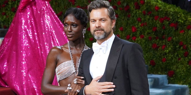 Jodie Turner-Smith embracing Joshua Jackson