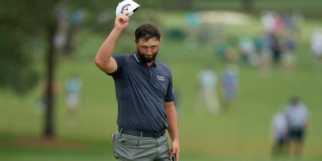 Jon Rahm of Spain waves after his putt on the 18th hole during the first round of the Masters at Augusta National Golf Club Thursday, April 6, 2023, in Augusta, Ga.