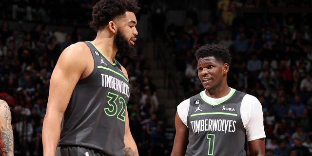 Karl-Anthony Towns #32 of the Minnesota Timberwolves talks with Anthony Edwards #1 of the Minnesota Timberwolves during the game against the Oklahoma City Thunder during the 2023 Play-In Tournament on April 14, 2023, at Target Center in Minneapolis, Minnesota.E 