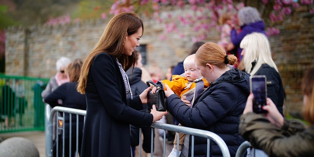 Baby grabbing Kate Middleton's purse