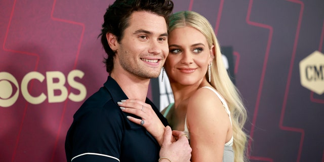 Chase Stokes and Kelsea Ballerini walk their first red carpet together at the CMT Music Awards.