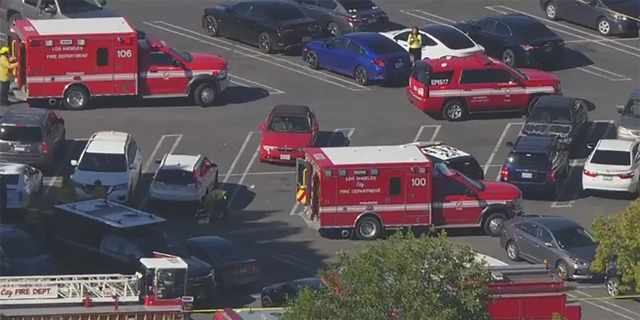 Los Angeles Fire Department vehicles responded to a shooting scene in a Trader Joe's parking lot in West Hills.