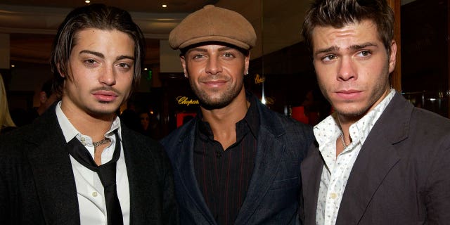 Lawrence brothers stand next to each other at Hollywood party