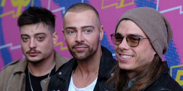 Lawrence brothers stand next to each other at Hollywood party