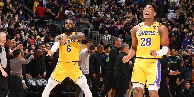 LeBron James #6 of the Los Angeles Lakers and Rui Hachimura #28 celebrate during the 2023 Play-In Tournament on April 11, 2023 at Crypto.Com Arena in Los Angeles, California.Â