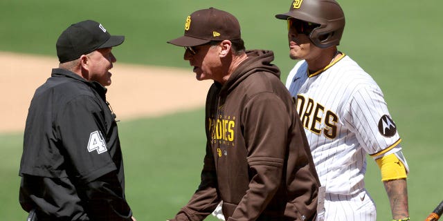 Manager Bob Melvin, center, argues with umpire Ron Kulpa after Manny Machado of the San Diego Padres was called out on a timed third strike during the first inning of a game against the Arizona Diamondbacks at PETCO Park April 4, 2023, in San Diego.