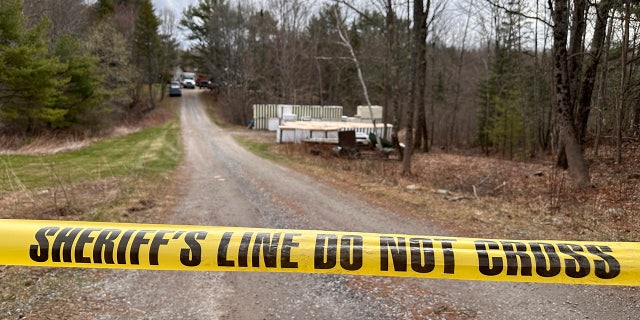 crime scene tape along road