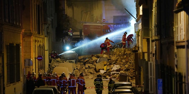 Firefighters worked Sunday to put out a fire deep within the rubble that hindered rescue efforts.