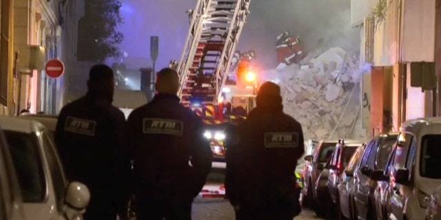 In this screengrab obtained from social media video, firefighters scoured the debris in search of victims trapped beneath the rubble.