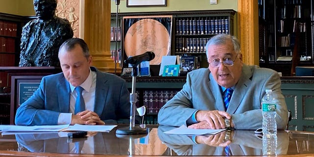 Massachusetts lawmakers, including House Ways and Means Chair Aaron Michlewitz, left, and Speaker Ronald Mariano, unveiled a $56.2 billion budget proposal for the coming fiscal year.