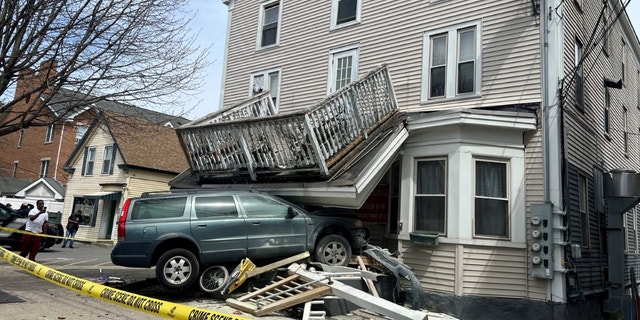 Methuen police found that the Volvo station wagon plunged into a building and collapsed its front porch.