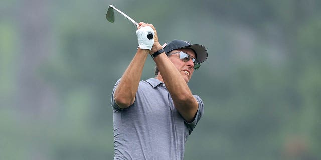 Phil Mickelson of The United States plays his second shot on the 14th hole during practice prior to the 2023 Masters Tournament at Augusta National Golf Club on April 4, 2023 in Augusta, Georgia.
