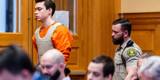 Willard Miller is led into a courtroom, March 29, 2023, in Fairfield, Iowa, for a hearing related to the murder charge he faces in the 2021 death of Fairfield, Iowa, Spanish teacher Nohema Graber.