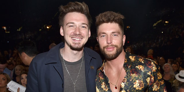 Chris Lane and Morgan Wallen smile at Academy Of Country Music Awards in 2018