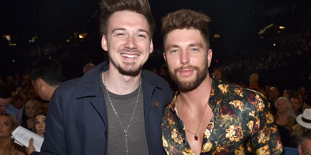 Chris Lane and Morgan Wallen smile at Academy Of Country Music Awards in 2018